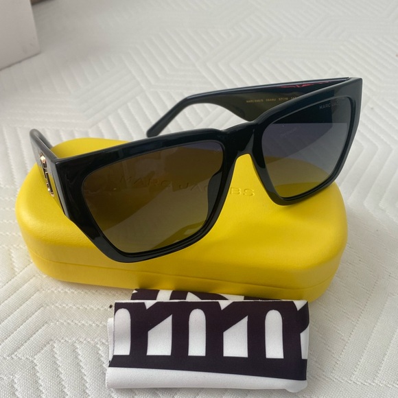 Marc Jacob’s dark frames with insigna on the sides....